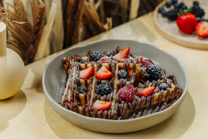 Signature BohoX Waffle Slathered in Rich Nutella Mousse Topped with Fresh Strawberries and Berries