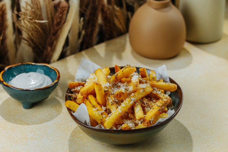 Truffle fries served with creamy dipping sauce at BohoX restaurant